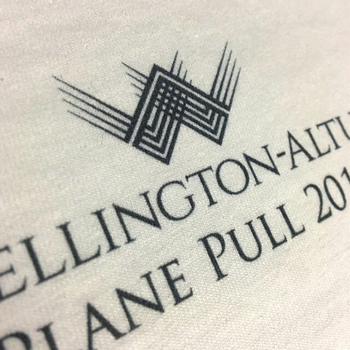 Black digital print on white garment.